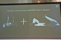 「ナインボット・ゴーカートキット ミニ プロ」は、立ち乗り式の電動二輪車「ミニ プロ」の本体をリアに組み込むことでドライブできるようになる。写真はその説明用スライド。