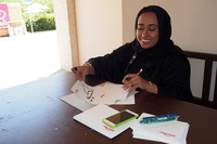 アラビア語で名前を書いてくれるコーナーだった。