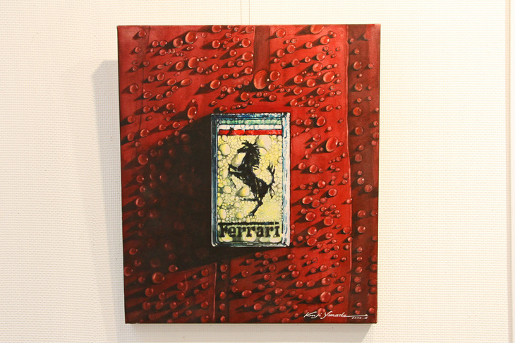 モデルは雨にぬれた山田さんの愛車「328GTB」。