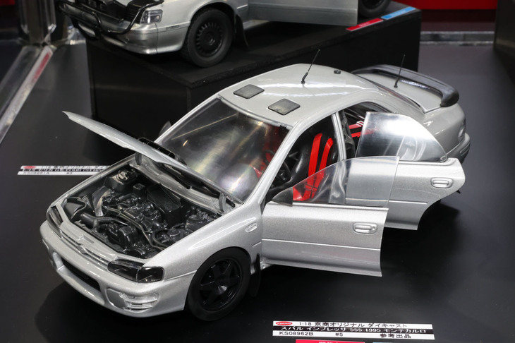 5月の静岡ホビーショーの時点ではモックアップだった京商オリジナルの1/18「スバル・インプレッサ555 1995モンテカルロ」。進行状況をファンに伝えるために展示された試作品。上にチラッと見える「トヨタ・セリカWRC」も同様。