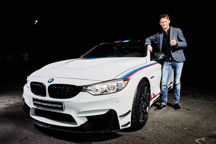 「BMW M4 DTMチャンピオンエディション」と、DTMの2016年ドライバーズタイトルを獲得したマルコ･ヴィットマン選手。