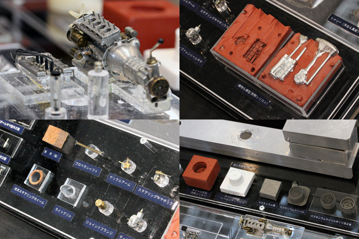 「アルファ・ロメオ・カングーロ」の、製作過程を含めたパーツ類。真ちゅうと洋白でフレームを組み、アルミ板からボディーをたたき出し、エンジンやホイールなどはアルミやマグネシウムを使って鋳造、タイヤも型から製作。ステアリングギアボックスは実車同様に可動する構造で、ステアリングのリムは木片から削り出し。ちなみにエンジンは、クランクシャフトを回すとコンロッドを介してピストンが上下する。「ピストンリングはありませんけどね」とのことだが……。