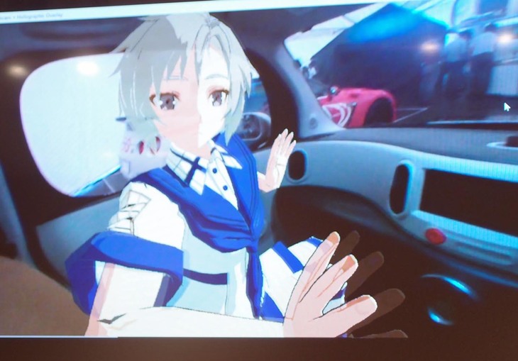 「助手席にバーチャルな彼女を乗せてドライブ」の図。「I2V」のテクノロジーが完成すると、このような体験が現実のものとなる。