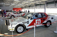 ピットビル屋上に展示された、「セリカ」および「カローラ」の歴代WRCマシンとパリダカ仕様の「ランドクルーザー」。