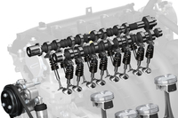 マツダのガソリンエンジン「SKYACTIV-G」の動弁機構（2010年）。カムシャフトが回転すると、卵型のカムがバルブを押し下げ、吸／排気を行う仕組みとなっている。