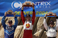 
	表彰台の3人。中央がブーデ、左に2位のポール・トレーシー、右は3位のジュンケイラ。
	 