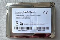 保険会社のウニポールから入手した、イタリア版ETC「ウニポール・ムーブ」の車載機は、業務用冷凍食品のような仰々しい容器に入っていた。