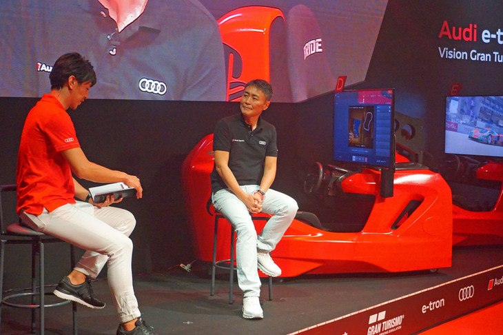 続いて壇上に上がったのは、ポリフォニー・デジタル代表取締役であり、『グランツーリスモ』シリーズのプロデューサーである山内一典氏。自動車メーカーとのコラボレーション企画である「ビジョン グランツーリスモ」について聞かれると、「すてきなクルマをつくるためのきっかけになれないかと考えたのがはじまり。今でもクルマづくりを楽しんでいますかという、メーカーに向けた問いかけ、またはメッセージでもあった」とコメントした。