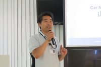 NISMO GT-R LM 22号車の担当エンジニアである山洞博司氏。「ルマンじゃありませんが、24時間電話に出られるようにしておきますので、分からないことがあったらいつでも連絡してください」