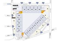 センターの俯瞰（ふかん）図。E、W、Nの展示場群が三角形を構成している。（写真＝SNIEC）