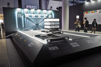 「Startup Future Factory」に出展していたCUEBUS（キューバス）のブース。リニアモーター技術を用いた物流システムが紹介されていた。