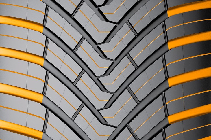 トレッド面では、やや太いV字型の溝が特徴的（黄色いカラーリングは機能・デザイン説明用のもの）。