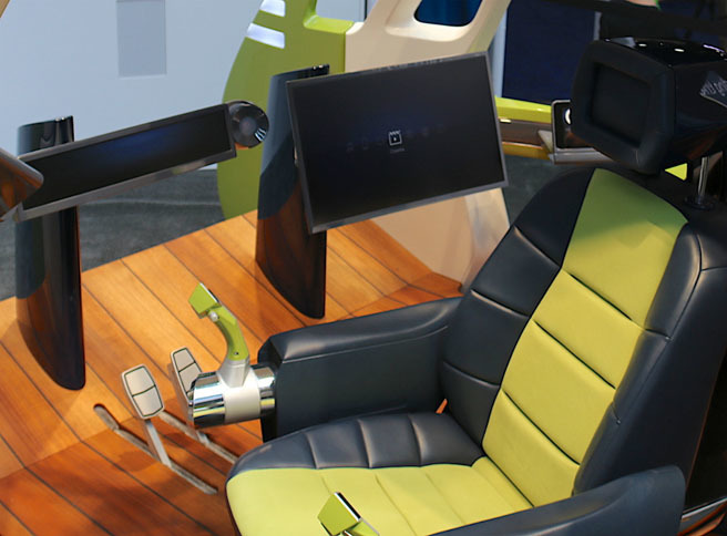 ボディ・コントロール・システムズによる、コックピットのコンセプト展示「サーフィンカーブ」。「ステアリングを廃して“ジョイスティック”に置き換えることで、車室スペースも有効活用できる」と説く。5～10年後の実用化を目指すという。
