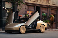 テスラが発表した「ロボタクシー」。米ロサンゼルスのワーナー・ブラザースのスタジオで公開された。